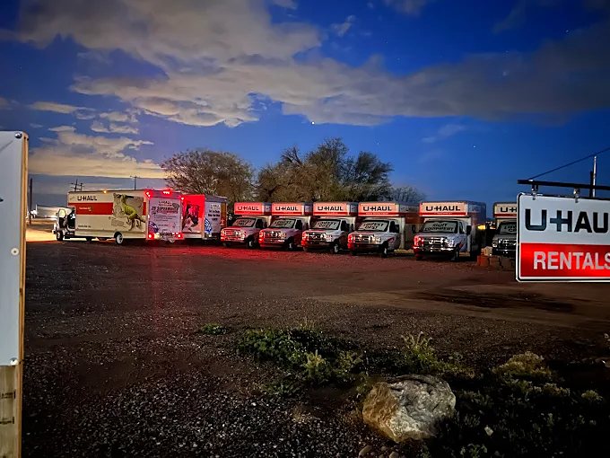 The lot at night with the U-Haul Rentals sign